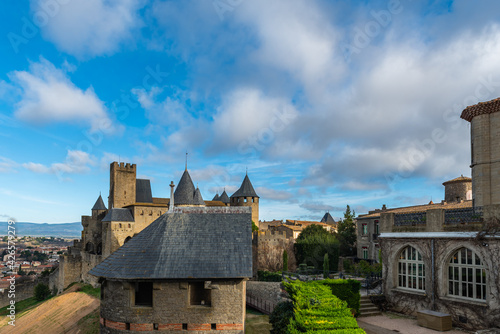 View over the historical castle carcassone - cite de carcassone - with the towers and a yard, background blue sky