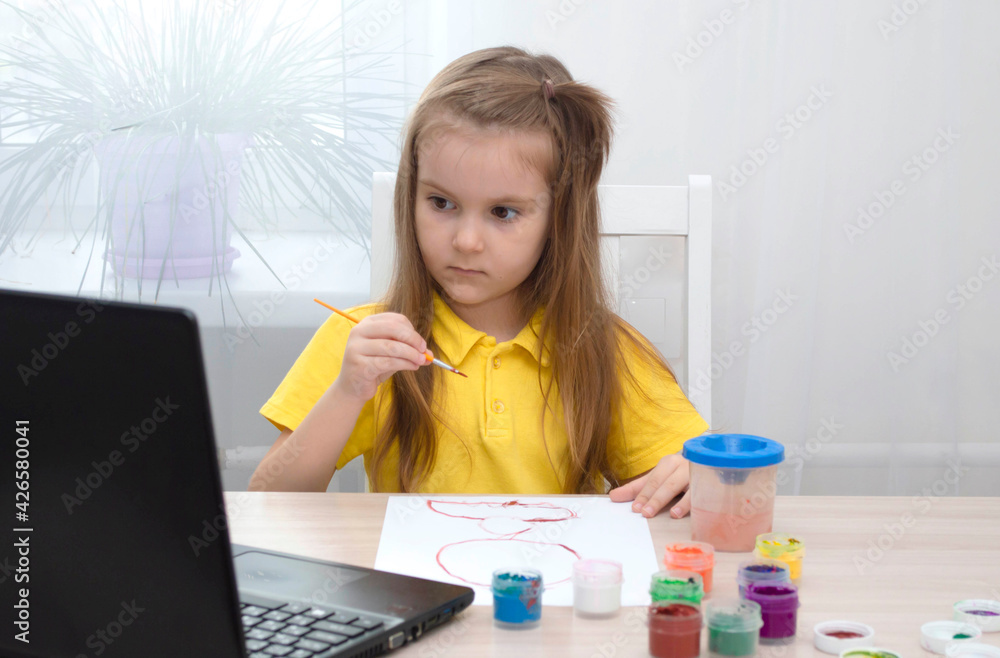 Concept of distance education. Girl learns draw online during self-isolation. Study online. Drawing lesson with laptop. Draw picture with colors. Life in digital age. back to school Concept of distance education. Girl learns draw online during self-isolation. Study online. Drawing lesson with laptop. Draw picture with colors. Life in digital age. back to school