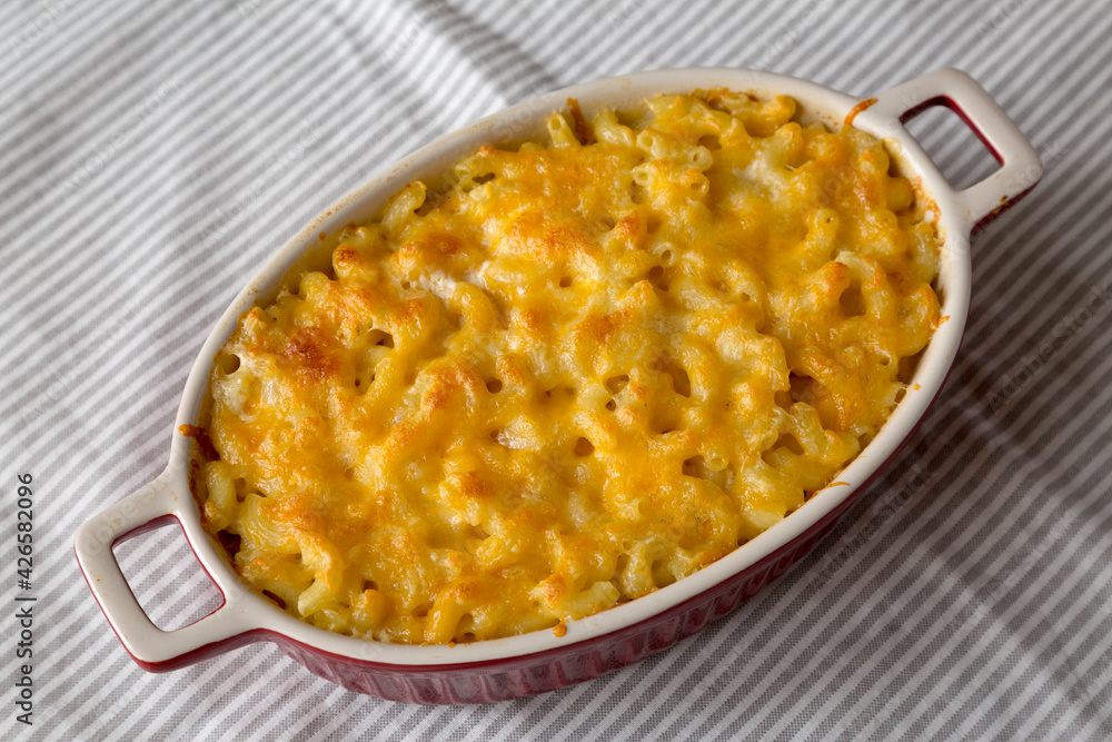 Homemade Macaroni and Cheese Pasta on cloth, low angle view. Homemade Macaroni and Cheese Pasta on cloth, low angle view.