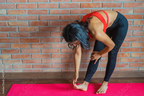 Young indian woman doing yoga