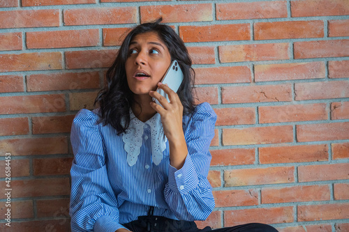 Young indian woman using a mobile phone
