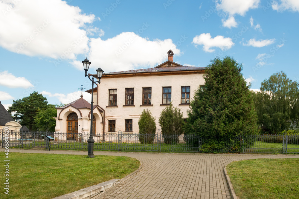 Fototapeta premium View of the stone two-story abbot building (1530s) with a fraternal refectory, kitchen and cells. Holy Dormition Monastery, Staritsa, Tver Region.