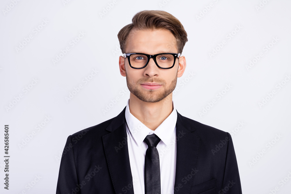 Photo of young handsome business man confident focused wear glasses isolated over grey color background Photo of young handsome business man confident focused wear glasses isolated over grey color background