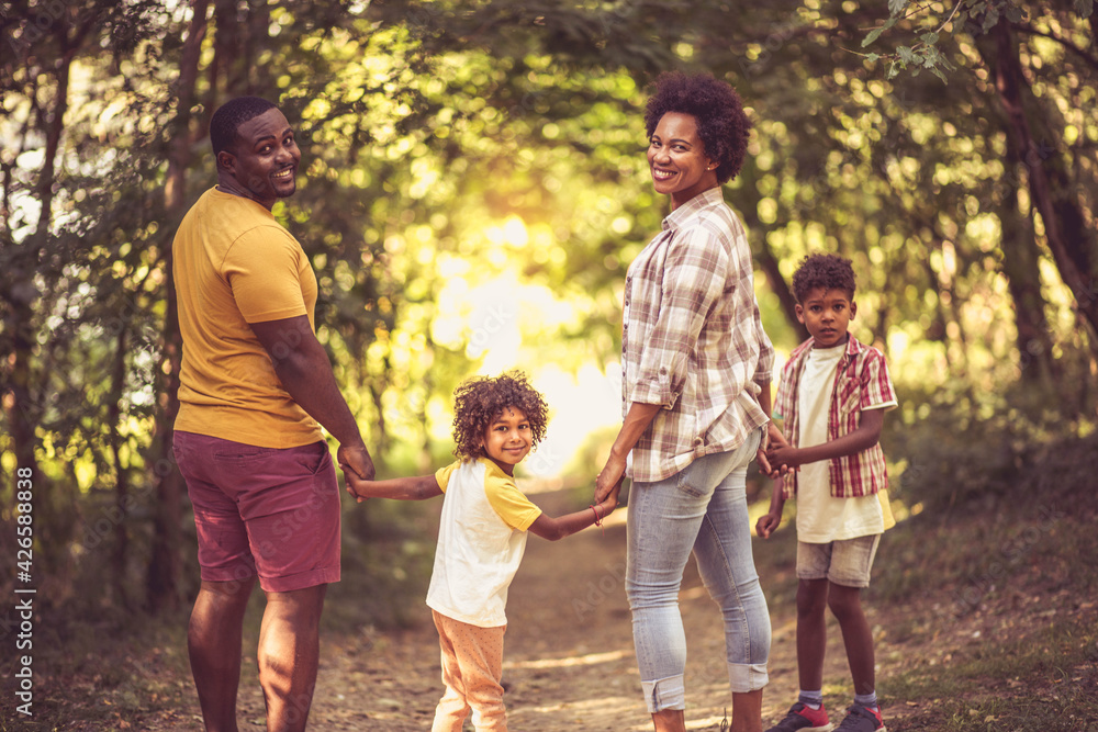 Fototapeta premium African American family having fun outdoors.
