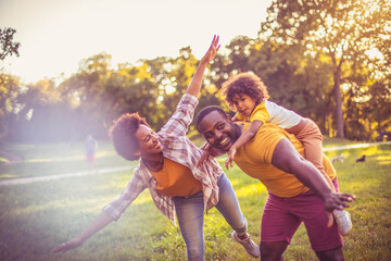  African American family having fun outdoors.