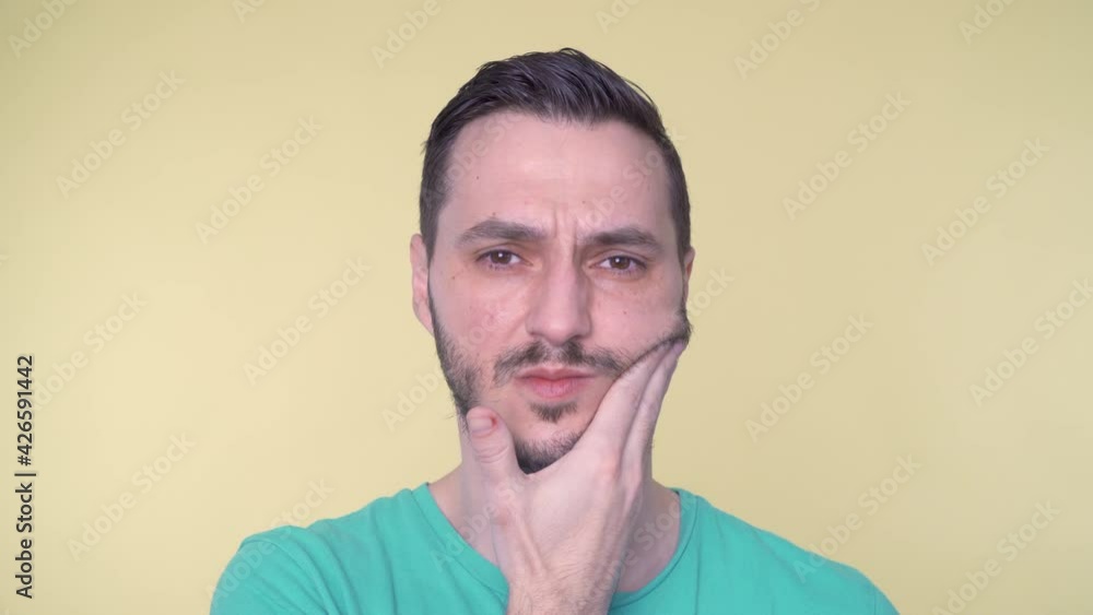 Young man with toothache in pain Young man with toothache in pain