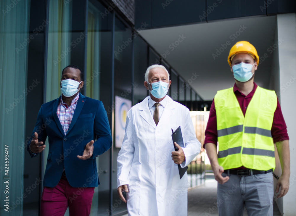 Business man doctor and engineer walking trough street. Business man doctor and engineer walking trough street.