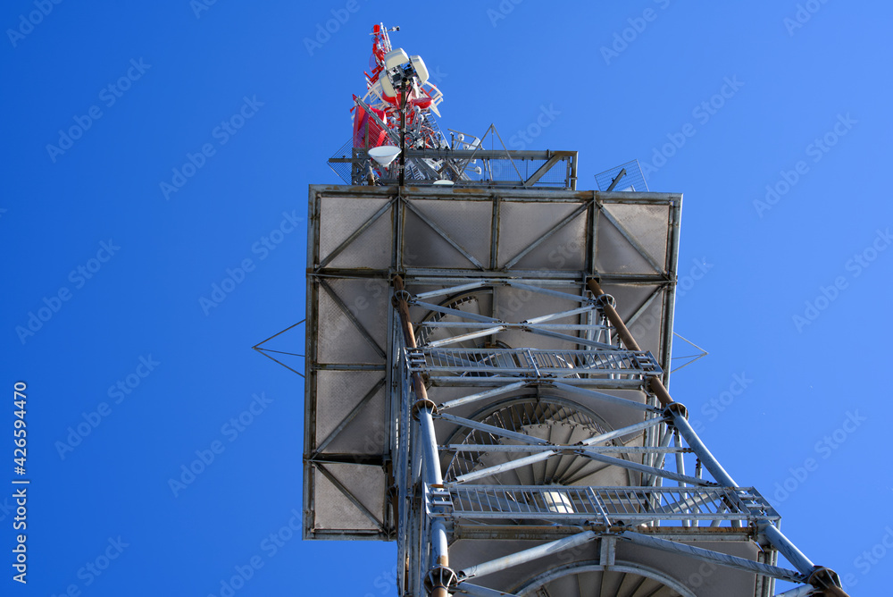 Transmission tower with viewpoint platform at mountain named Bachtel at Zürcher Oberland (Zurich Highlands). Photo taken April 8th, 2021, Bachtel, Switzerland. Transmission tower with viewpoint platform at mountain named Bachtel at Zürcher Oberland (Zurich Highlands). Photo taken April 8th, 2021, Bachtel, Switzerland.