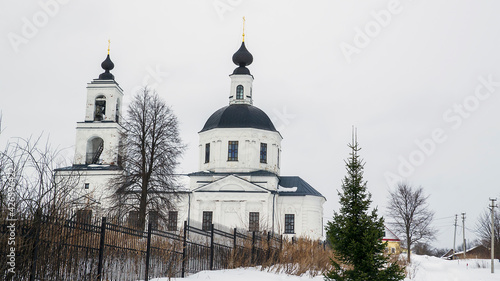 landscape with a rural orthodox church in winter