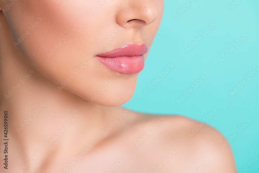 Cropped photo of young charming lovely stunning woman with nude lipstick botox injection isolated on teal color background Cropped photo of young charming lovely stunning woman with nude lipstick botox injection isolated on teal color background