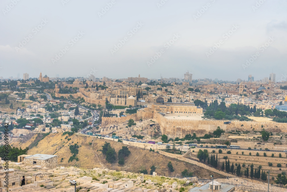 The old city Jerusalem and monumental defensive walls. The Jewish Cemetery on the Mount of Olives, the Dome of the Rock. Most important world holy places. Israel landmarks