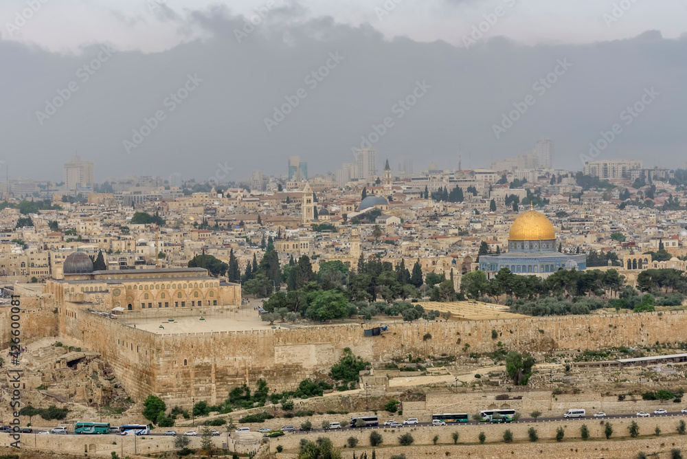 Fototapeta premium Most important world holy places. Panorama of the old city Jerusalem, the Dome of the Rock, monumental defensive walls