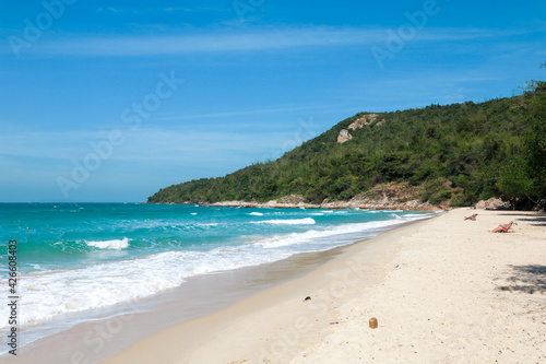 the tropical sandy beach with blue wave and clear sky in summer time © chayakorn