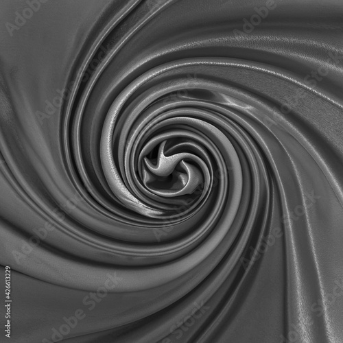 Luxury silk black cloth swirl texture for design abstract background