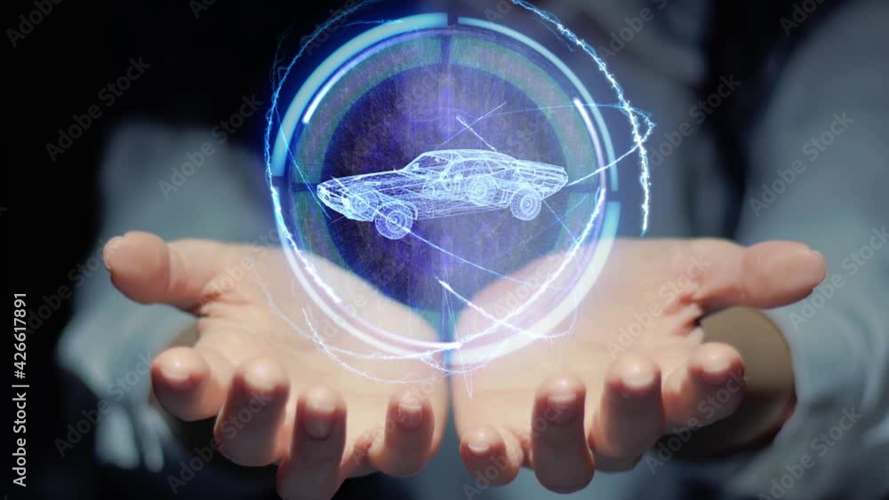Female hands show a round conceptual hologram with retro Racing Car. Unrecognizable woman in ashen white on a black background with future holographic technology Female hands show a round conceptual hologram with retro Racing Car. Unrecognizable woman in ashen white on a black background with future holographic technology