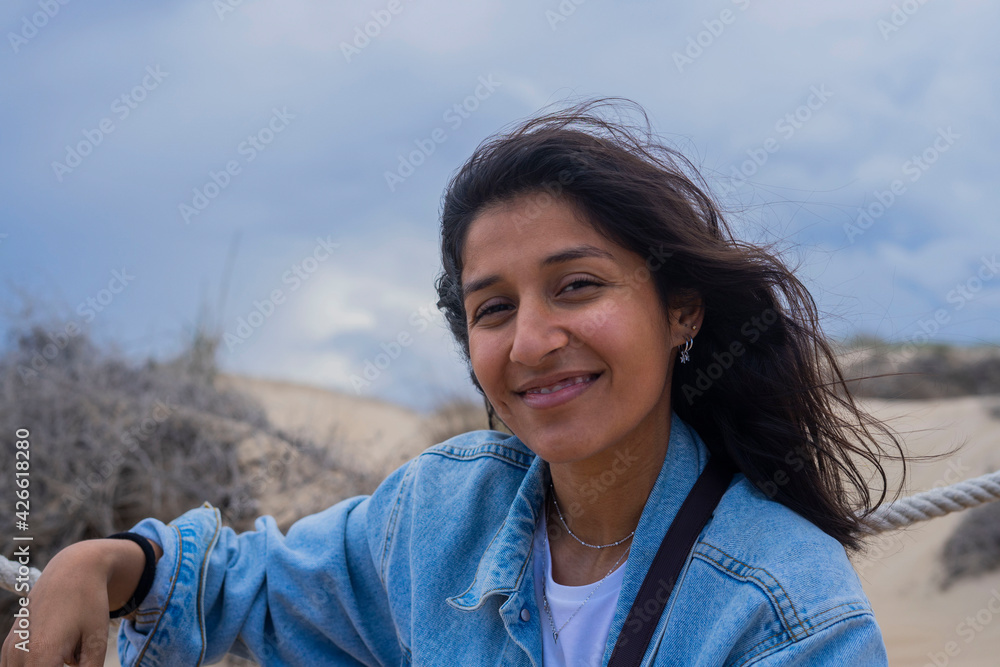 Young Indian woman happy in beach 
