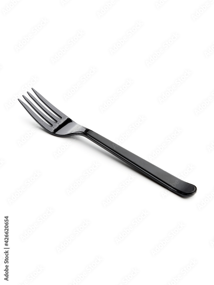 Plastic black disposable fork isolated on a white background. Disposable tableware Plastic black disposable fork isolated on a white background. Disposable tableware