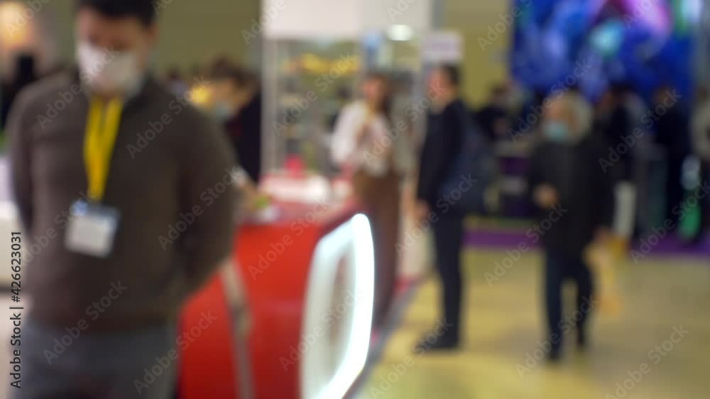 Blurred background on a business theme. Unrecognizable people inside a modern large bright business center. Blurred background on a business theme. Unrecognizable people inside a modern large bright business center.