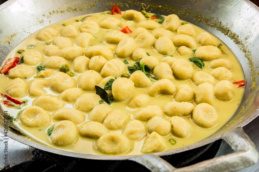 Cooking fish ball green curry in pan, Thai famous food. Cooking fish ball green curry in pan, Thai famous food.