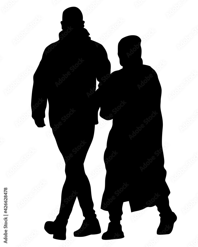 Young man and woman walking down the street. Isolated silhouette on a white background