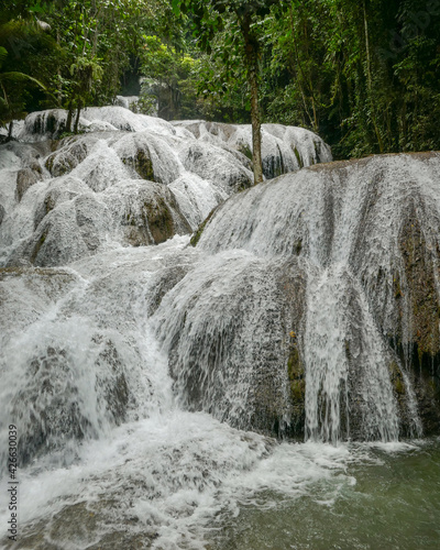 Beautiful view of landmark Saluopa waterfall, near Tentena and lake Poso, Central Sulawesi, Indonesia photo