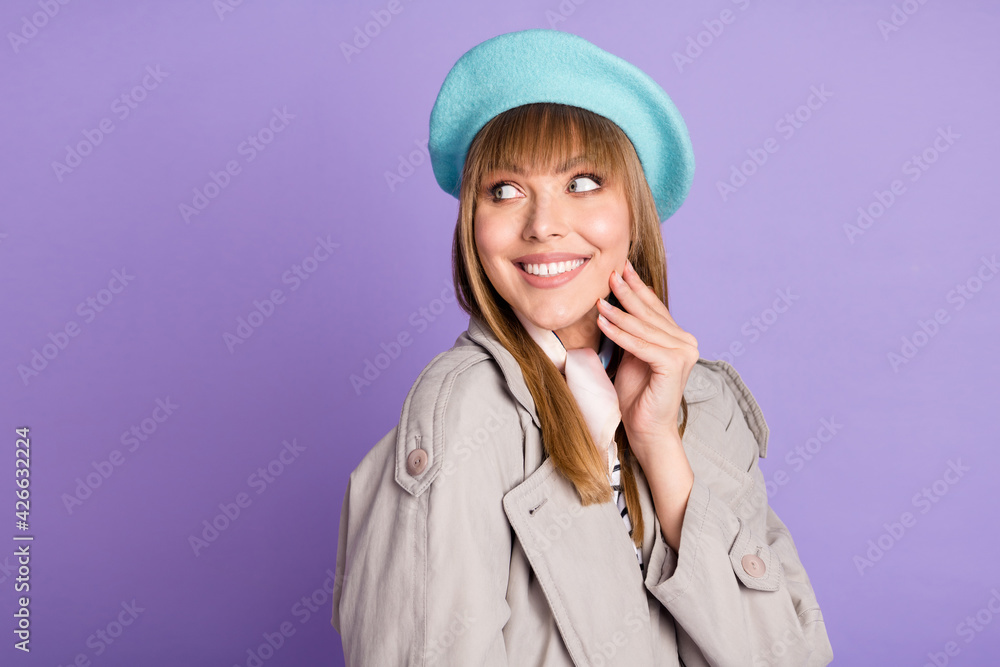 Photo of dreamy lovely girl look empty space hand cheekbone wear blue beret coat isolated violet color background Photo of dreamy lovely girl look empty space hand cheekbone wear blue beret coat isolated violet color background