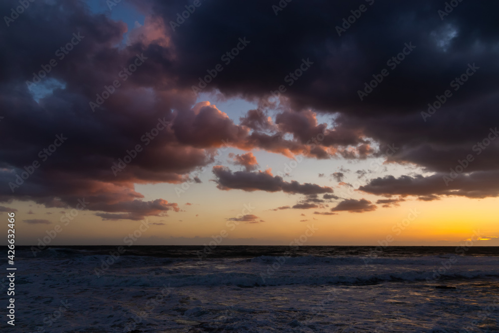 Cloudy sunset at the stormy sea. Cloudy sunset at the stormy sea.