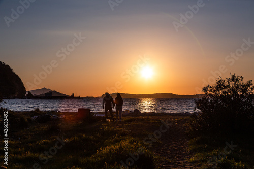 Napoli (Italy) - Bagnoli, Coroglio beach at the sunset, in the western part of Napoli, ex area of ​​the Italsider factories photo