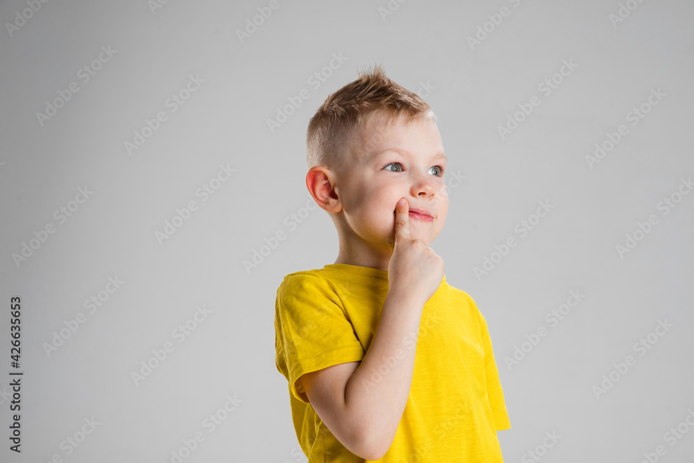 Happy boy isolated on white studio background. Looks happy, cheerful, sincere. Copyspace. Childhood, education, emotions concept Happy boy isolated on white studio background. Looks happy, cheerful, sincere. Copyspace. Childhood, education, emotions concept