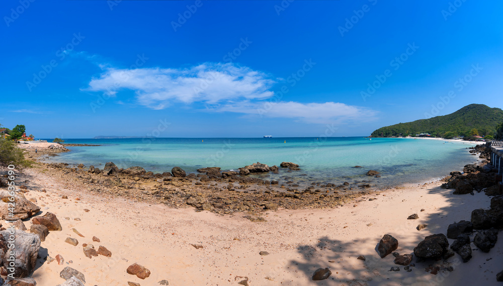 panorama landscape of sand and rock beach with blue sea and clear sky with clouds, relax seascape view at Thian beach, Koh Larn island, Chonburi, Thailand