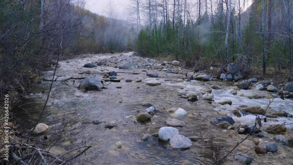 Surroundings of Lake Baikal. Khamar-Daban ridge, Slyudyanka mountain river. Surroundings of Lake Baikal. Khamar-Daban ridge, Slyudyanka mountain river.