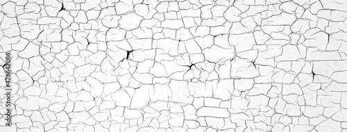 ひび割れのある白い壁のの背景テクスチャー