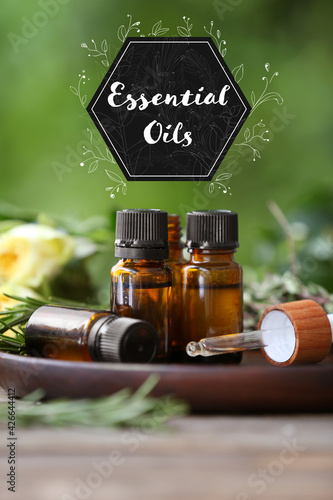 Bottles of essential oil on...