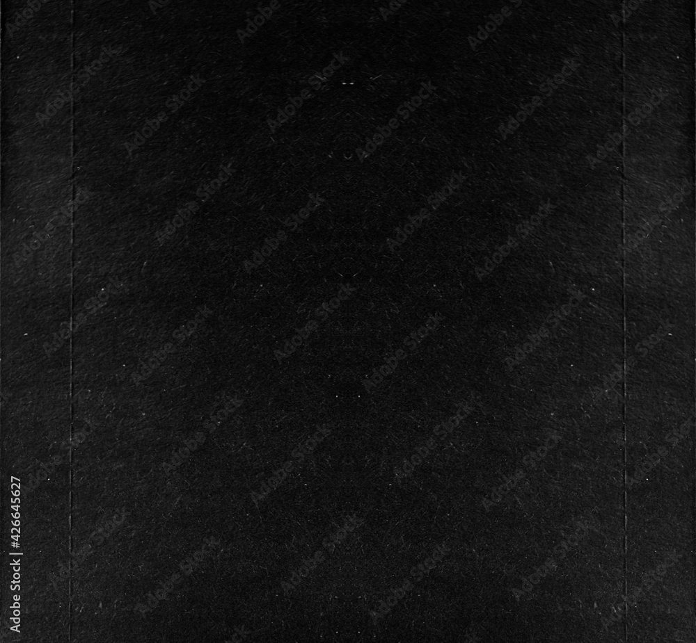Black paper background. Contrast and minimalism concept.