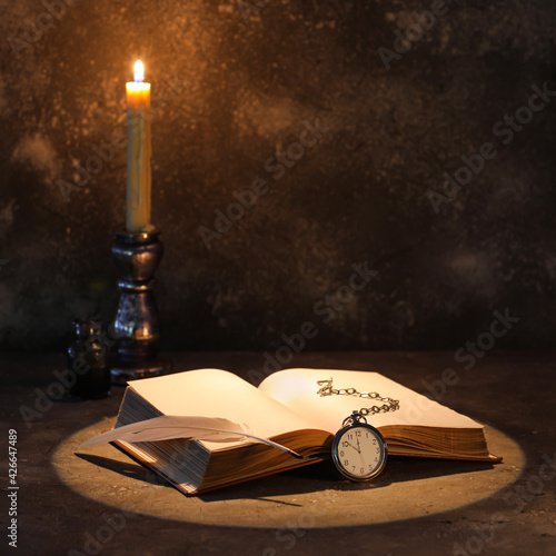 Open old book with clock, f...