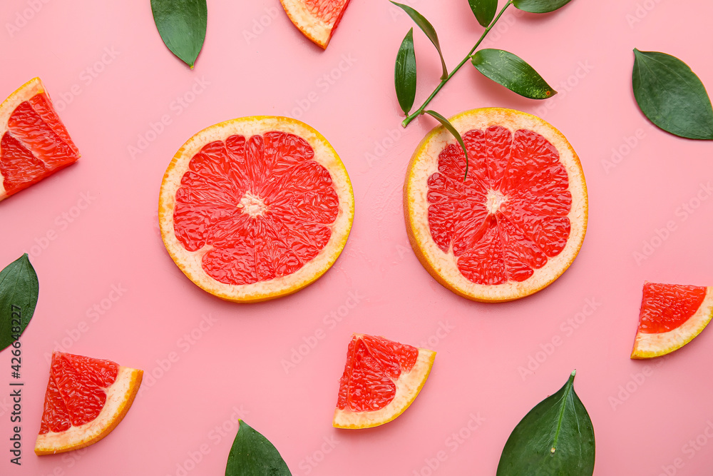 Fresh sliced grapefruit on color background