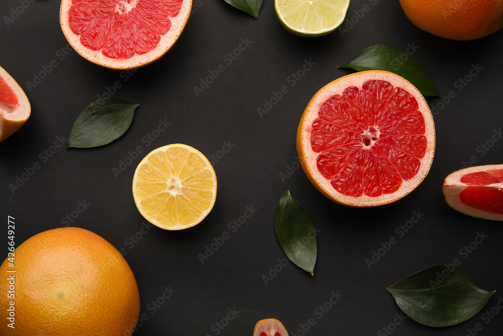 Fresh citrus fruits on dark background Fresh citrus fruits on dark background