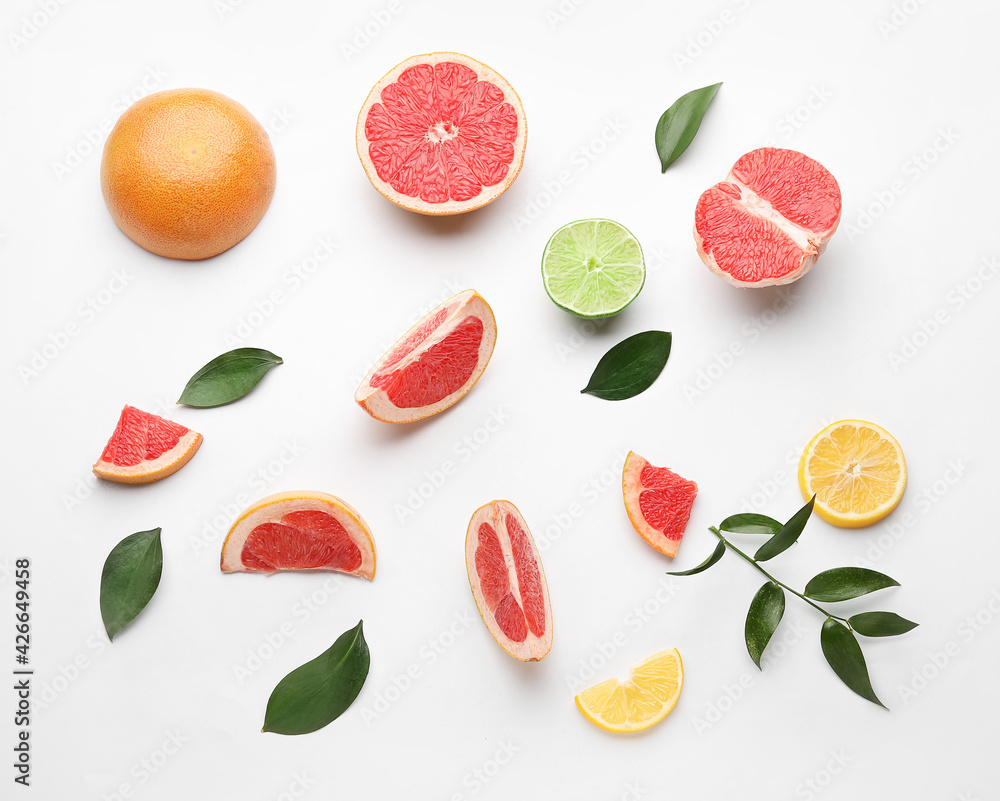 Fresh cut citrus fruits on white background Fresh cut citrus fruits on white background