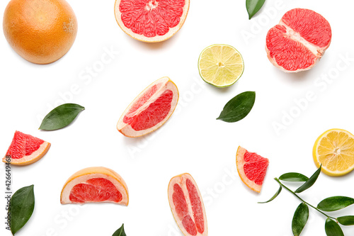 Fototapeta Naklejka Na Ścianę i Meble -  Fresh cut citrus fruits on white background