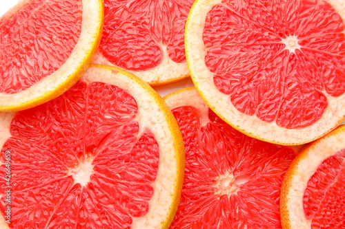 Fresh sliced grapefruit as background