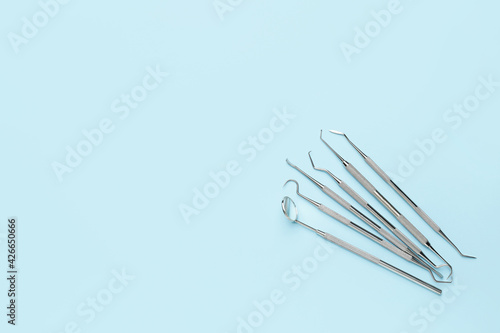 Dentist's tools on color ba...