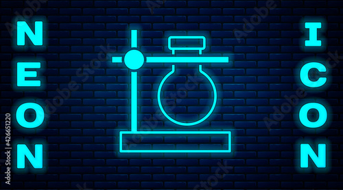 Glowing neon Glass test tube flask on stand icon isolated on brick wall background. Laboratory equipment. Vector
