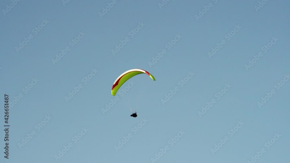 Paraglider against the clear blue sky Paraglider against the clear blue sky