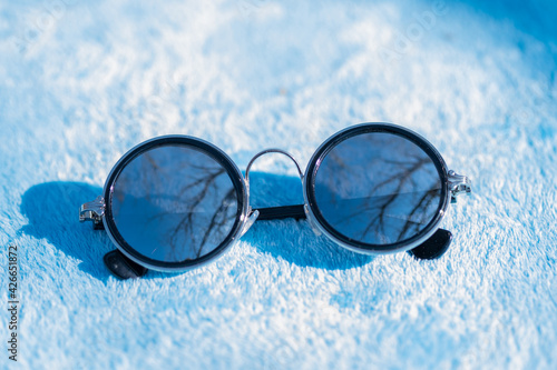 Classic sunglasses classic design with silver lenses shoot in a sunny day of summer closeup. Selective Focus. High quality photo