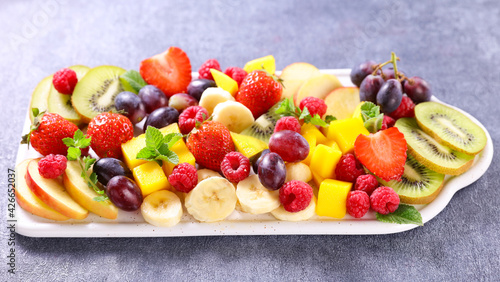 fresh fruit platter with berries fruits   mango   banana and grapes