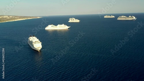 8 Empty cruise ships are staying near the coast of Cyprus. Flight above Cruise ships parking.