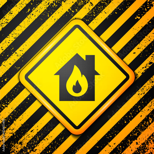 Black Fire in burning house icon isolated on yellow background. Warning sign. Vector