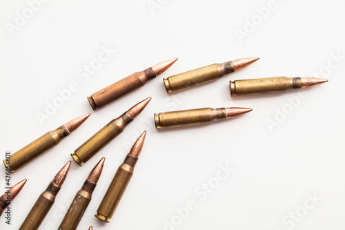 A group of bullet ammunition shells on a white background