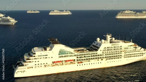 8 Empty cruise ships are staying near the coast of Cyprus. Flight above Cruise ships parking.