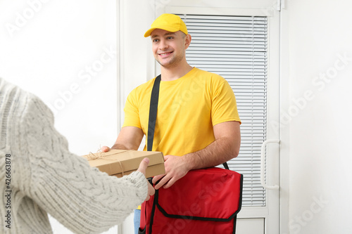 Woman receiving her order f...